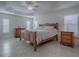 Spacious main bedroom with a wooden bed frame and nightstands at 3144 Blackstock Way, The Villages, FL 32163