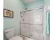 Clean bathroom with a shower and tub at 353 Ranchwood Dr, Leesburg, FL 34748