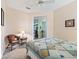 Bedroom with sitting area and adjacent room view at 353 Ranchwood Dr, Leesburg, FL 34748