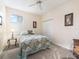 Cozy bedroom with a full bed and ceiling fan at 353 Ranchwood Dr, Leesburg, FL 34748