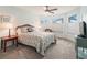 Bright bedroom with a queen-size bed and window seat at 353 Ranchwood Dr, Leesburg, FL 34748