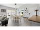 Dining area with a farmhouse style table and white chairs at 3575 Grouby Rd, The Villages, FL 32163