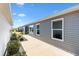 Exterior view of the house with a side patio at 3575 Grouby Rd, The Villages, FL 32163