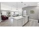 Modern kitchen with white cabinets, stainless steel appliances, and an island at 3575 Grouby Rd, The Villages, FL 32163