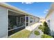 Screened patio with seating area and landscaping at 3575 Grouby Rd, The Villages, FL 32163