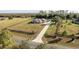 House on large lot with long driveway and fence at 41516 Saddle Ridge Ln, Weirsdale, FL 32195