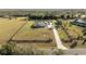 House on large lot with long driveway and fence at 41516 Saddle Ridge Ln, Weirsdale, FL 32195