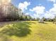 Large backyard with storage shed and open space at 41516 Saddle Ridge Ln, Weirsdale, FL 32195