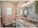 Elegant bathroom with granite countertops and a walk-in shower at 41516 Saddle Ridge Ln, Weirsdale, FL 32195