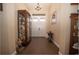 Bright entryway with double doors and hardwood floors at 41516 Saddle Ridge Ln, Weirsdale, FL 32195