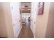 Bright hallway with wood-look tile flooring at 41516 Saddle Ridge Ln, Weirsdale, FL 32195