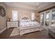 Main bedroom with a king-size bed and built-in storage at 41516 Saddle Ridge Ln, Weirsdale, FL 32195