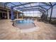 Relaxing pool area with a covered patio and seating at 41516 Saddle Ridge Ln, Weirsdale, FL 32195