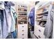 Well-organized walk-in closet with custom shelving at 41516 Saddle Ridge Ln, Weirsdale, FL 32195