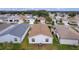 Rear view of house showing roofline and neighborhood context at 424 Rose Croft Ter, The Villages, FL 32162