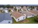 Rear view of house showing roofline and neighborhood context at 424 Rose Croft Ter, The Villages, FL 32162