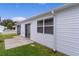 Home exterior showcasing a sliding glass door and windows at 424 Rose Croft Ter, The Villages, FL 32162