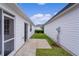 A cozy backyard offers a patio for outdoor lounging, and a compact lawn space at 424 Rose Croft Ter, The Villages, FL 32162