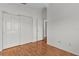 Bedroom featuring two closets, wood floors and ample space at 424 Rose Croft Ter, The Villages, FL 32162
