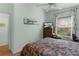 Bedroom with window, dresser, and ceiling fan at 424 Rose Croft Ter, The Villages, FL 32162