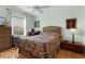 Bedroom with a ceiling fan and wicker furniture at 424 Rose Croft Ter, The Villages, FL 32162