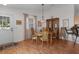 Dining area with a round wooden table and wicker chairs at 424 Rose Croft Ter, The Villages, FL 32162