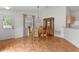 Dining area featuring wood floors and a dining table with chairs at 424 Rose Croft Ter, The Villages, FL 32162