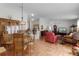 Open dining room with a wooden table and chairs at 424 Rose Croft Ter, The Villages, FL 32162