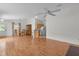 Bright living room showcasing wood floors, an open layout, and a ceiling fan at 424 Rose Croft Ter, The Villages, FL 32162