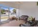 Relaxing screened porch with wicker furniture at 424 Rose Croft Ter, The Villages, FL 32162