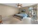 Spacious bedroom with carpeted floor, ceiling fan and large bed at 438 Woodview Dr, Tavares, FL 32778