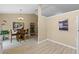 Bright dining area with table and chairs, wood-look floors, and artwork at 438 Woodview Dr, Tavares, FL 32778