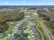 Aerial view of a neighborhood near a lake at 4406 Creighton Loop, The Villages, FL 32163