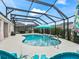 Relaxing screened pool area with lounge chairs at 4406 Creighton Loop, The Villages, FL 32163