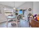 Dining area with glass-top table and access to a patio at 4518 Hummingbird Ln, Haines City, FL 33844