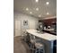 Kitchen island with white quartz countertop and seating at 4518 Hummingbird Ln, Haines City, FL 33844