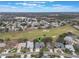 Aerial view showing home's location in golf course community at 4928 Kelso St, Leesburg, FL 34748