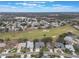 Community overview featuring a golf course and houses at 4928 Kelso St, Leesburg, FL 34748