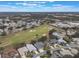 Aerial view of community with golf course and lake at 4928 Kelso St, Leesburg, FL 34748