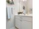 Small bathroom with single vanity, mirror and wreath decor at 4928 Kelso St, Leesburg, FL 34748