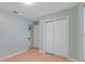 Simple bedroom with large closet and wood flooring at 500 Southern Charm Dr, Orlando, FL 32807