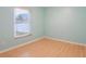 Simple bedroom with window and laminate wood flooring at 500 Southern Charm Dr, Orlando, FL 32807