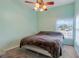 Spacious bedroom with ceiling fan and large window at 500 Southern Charm Dr, Orlando, FL 32807