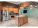 Modern kitchen with stainless steel appliances and a large island at 500 Southern Charm Dr, Orlando, FL 32807