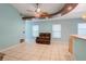 Relaxing living room with tiled floor, recessed lighting, and a comfy recliner at 500 Southern Charm Dr, Orlando, FL 32807