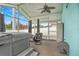 Relaxing screened porch with hot tub and seating area at 500 Southern Charm Dr, Orlando, FL 32807