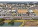 Aerial view showcasing townhome community near shops at 5278 Dragonfly Dr, Wildwood, FL 34785