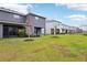 Row of townhouses with a view of a pond and conservation area at 5278 Dragonfly Dr, Wildwood, FL 34785