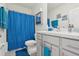 Bright bathroom with shower, vanity, and blue accents at 5278 Dragonfly Dr, Wildwood, FL 34785