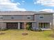 Townhome back with screened patio and landscaping at 5278 Dragonfly Dr, Wildwood, FL 34785